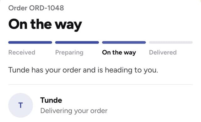 The customer's tracking page, with the rider on the way