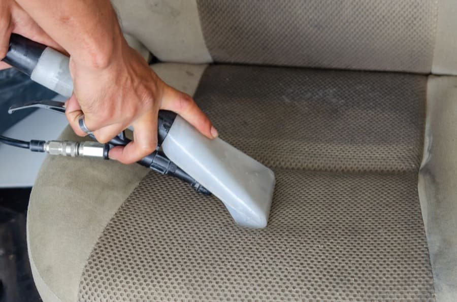 A car seat being shampooed